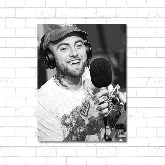 Man with tattoos and headphones in front of a microphone on a white brick wall background